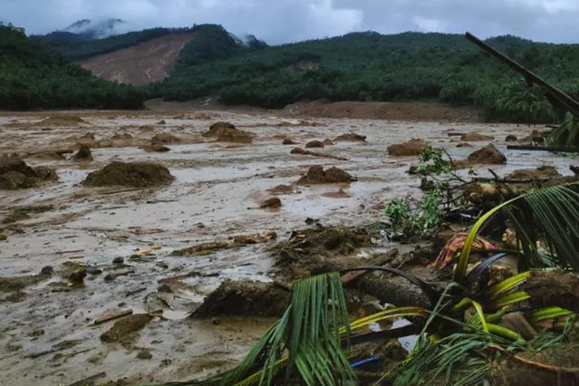 This photo provided by the Philippine Coast Guard, shows a landslide area at Baybay City, Leyte province, central Philippines Monday, April 11, 2022. Heavy rains caused by a summer tropical depression killed at least several people in the central and southern Philippines, mostly due to landslides, officials said Monday. (Photo by Philippine Coast Guard via AP Photo)