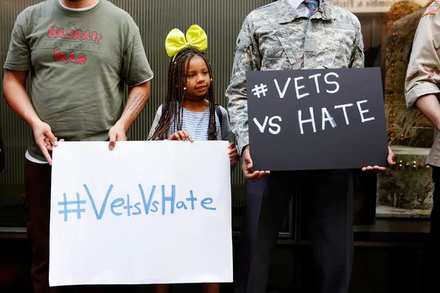 Nyla Joseph, 9, a daughter of a U.S. military veteran demonstrates with veterans outside Republican presidential candidate Donald Trump's news conference outside Trump Tower in New York, U.S., May 31, 2016. (Photo by Shannon Stapleton/Reuters)