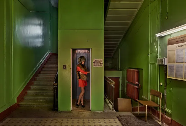 A young woman takes the elevator at the house of former Russian political leader Sergei Kirov in St Petersburg. (Photo by by Frank Herfort/The Guardian)