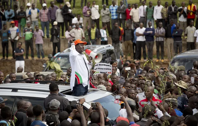 Opposition leader Raila Odinga leads a demonstration calling for the disbandment of the national electoral commission over allegations of bias and corruption, in downtown Nairobi, Kenya Monday, June 6, 2016. (Photo by Ben Curtis/AP Photo)