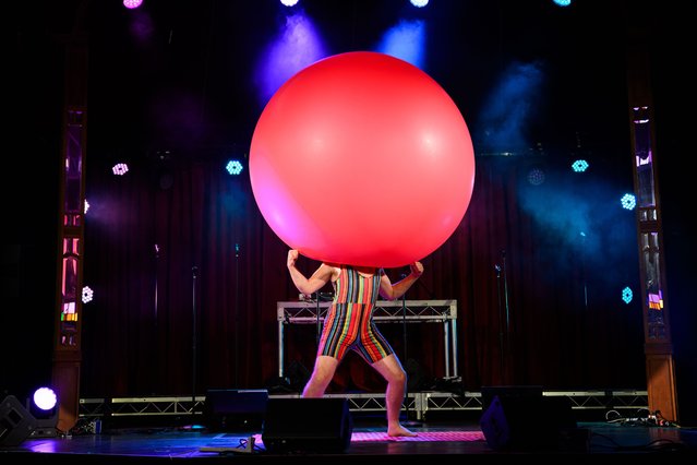 Dizzy O’Dare performs his giant balloon show during the launch of the Sydney fringe festival at Spiegeltent Festival Garden in Sydney, Australia on September 2, 2024. (Photo by Bianca de Marchi/AAP)