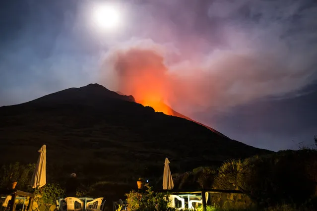 Hot lava trickles down from the Stromboli volcano on August 9, 2014 in Aeolian Islands, Italy. Lava flows down the Mount Stromboli off the Sicilian coast in southern Italy. The volcano – at 3,034ft – is one of the most active in Europe and has been erupting continuously since 1932. (Photo by Tom Pfeiffer/Barcroft Media)