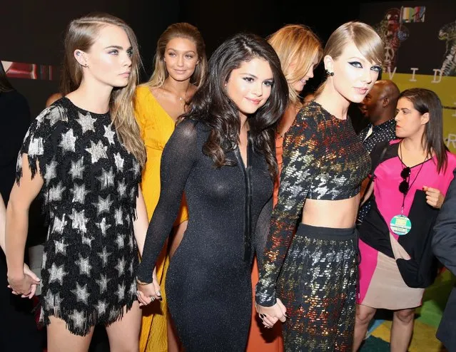 Cara Delevingne, from left, Gigi Hadid, Selena Gomez and Taylor Swift arrive at the MTV Video Music Awards at the Microsoft Theater on Sunday, August 30, 2015, in Los Angeles. (Photo by Matt Sayles/Invision/AP Photo)