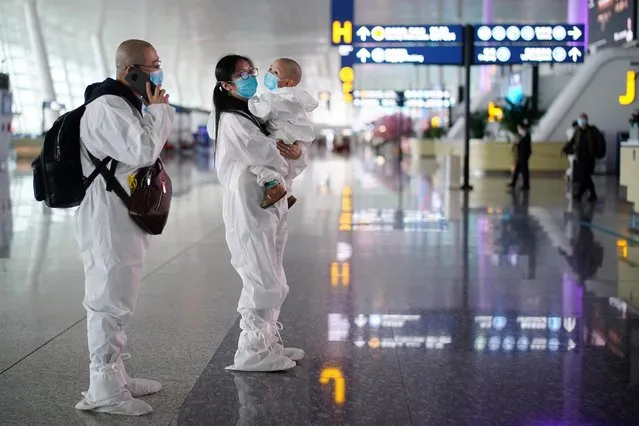 Travellers in protective suits are seen at Wuhan Tianhe International Airport after the lockdown was lifted in Wuhan, the capital of Hubei province and China's epicentre of the novel coronavirus disease (COVID-19) outbreak, April 10, 2020. (Photo by Aly Song/Reuters)