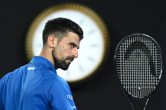 Novak Djokovic of Serbia reacts during his Men's Singles quarterfinal match against Carlos Alcaraz of Spain at the Australian Open tennis tournament in Melbourne, Australia, 21 January 2025. (Photo by Joel Carrett/EPA)