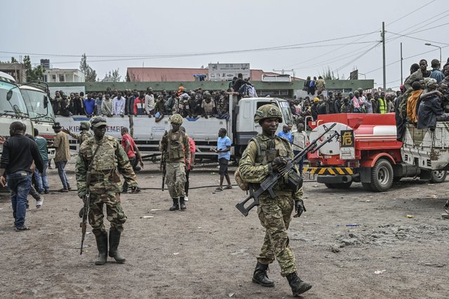 M23 rebels escort government soldiers and police who surrendered to an undisclosed location in Goma, Democratic republic of the Congo, Thursday, January 30, 2025. (Photo by Moses Sawasawa/AP Photo)