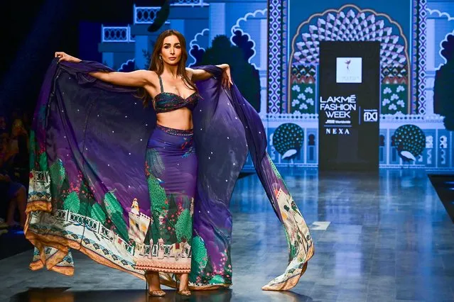 Bollywood actress Malaika Arora presents a creation by designer Limerick during the FDCI X Lakme Fashion Week in Mumbai on October 14, 2022. (Photo by Sujit Jaiswal/AFP Photo)
