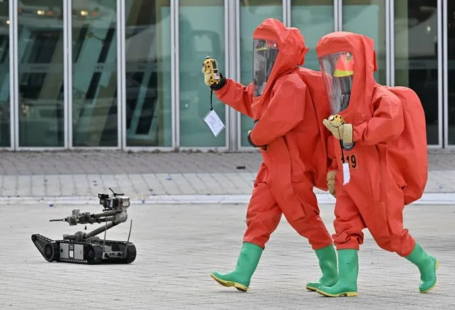 Emergency service members wearing bio-hazard suits participate in an anti-terror drill at the Kintex exhibition centre in Goyang on October 27, 2022.  (Photo by Jung Yeon-je/AFP Photo)