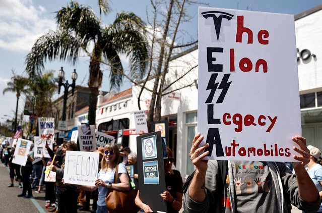 Protesters demonstrate against Tesla CEO Elon Musk’s Department of Government Efficiency (DOGE) initiatives during a nationwide “Tesla Takedown” rally outside a dealership on March 29, 2025 in Pasadena, California. Protesters in more than 30 states nationwide are demonstrating against the Department of Government Efficiency during what organizers are calling a global day of action. (Photo by Mario Tama/Getty Images)