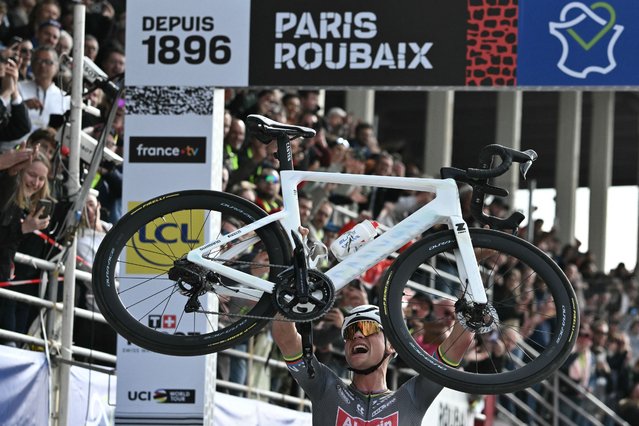 Alpecin-Deceuninck's Dutch rider Mathieu van der Poel celebrates after crossing the finish line to win the 122nd edition of the Paris-Roubaix one-day classic cycling race, 259,2 km between Compiegne and Roubaix, at the Vélodrome André-Pétrieux in Roubaix, northern France on April 13, 2025. (Photo by Jeff Pachoud/AFP Photo)