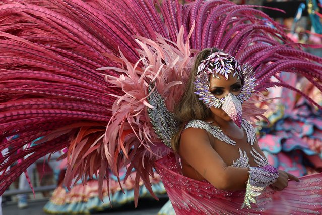 A reveller from Rosas de Ouro school performs during the first night of the Carnival parade at Anhembi Sambadrome in Sao Paulo, Brazil on February 10, 2024. (Photo by Carla Carniel/Reuters)