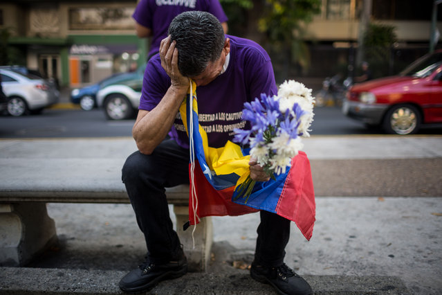 A man cries at a demonstration against the detention of political prisoners, in Caracas, Venezuela, 14 April 2025. Dozens of relatives of those considered political prisoners in Venezuela gathered in Caracas to pray at the Stations of the Cross during Holy Week and to pray for the release of their loved ones, most of whom were detained in the context of the crisis following last July's elections in the country. (Photo by Miguel Gutiérrez/EPA/EFE)
