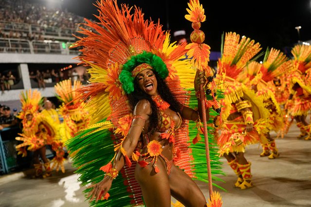 Performers from the Mocidade samba school parade during Carnival celebrations at the Sambadrome in Rio de Janeiro, Brazil, Monday, February 12, 2024. (Photo by Silvia Izquierdo/AP Photo)