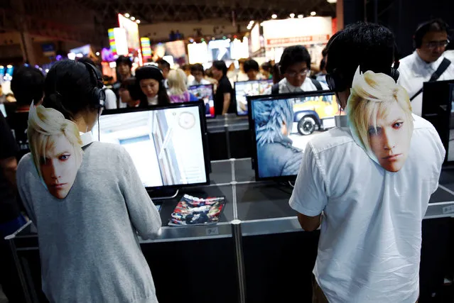 People play video game “Final Fantasy XV” at Tokyo Game Show 2016 in Chiba, east of Tokyo, Japan, September 15, 2016. (Photo by Kim Kyung-Hoon/Reuters)