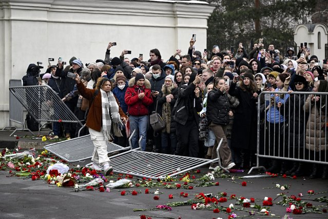 Mourners follow the hearse carrying the coffin of late Russian opposition leader Alexei Navalny after it left the Mother of God Quench My Sorrows church towards the Borisovo cemetery for Navalny's burial, in Moscow's district of Maryino on March 1, 2024. (Photo by Alexander Nemenov/AFP Photo)