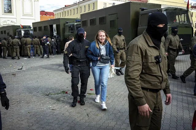 A police officer detains a protester during an opposition rally to protest the official presidential election results in Minsk, Belarus, Saturday, September 12, 2020. Daily protests calling for the authoritarian president's resignation are now in their second month and opposition determination appears strong despite the detention of protest leaders. (Photo by Misha Friedman/AP Photo)