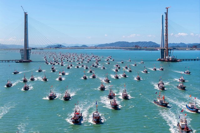 Fishing boats head out to the East China Sea on the first day after a four and a half month fishing moratorium ended, at Ningbo, in China's eastern Zhejiang province on September 16, 2025. (Photo by AFP Photo/China Stringer Network)