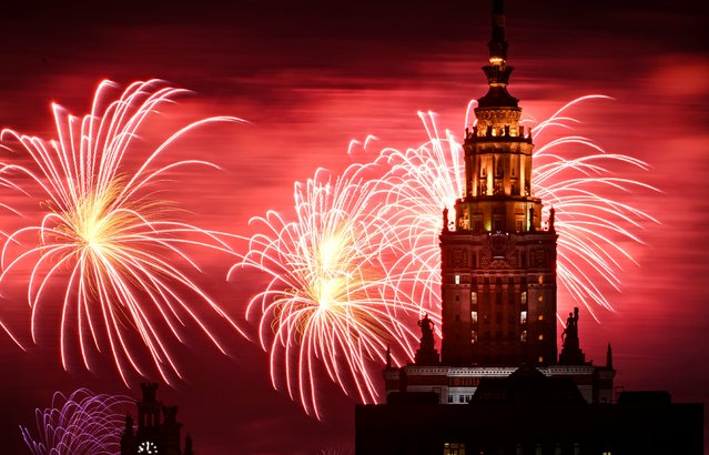 Fireworks explode behind the Moscow State University during Victory Day celebrations in Moscow on May 9, 2024, as Russia celebrates the 79th anniversary of the victory over Nazi Germany in World War II. (Photo by Alexander Nemenov/AFP Photo)