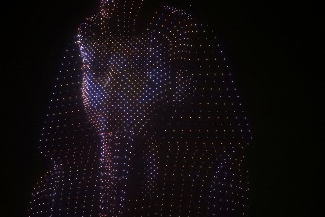 A drone light show depicts the mask of ancient pharaoh king Tutankhamen during the opening ceremony of the Grand Egyptian Museum (GEM), near the Giza pyramid complex, in Giza, Egypt, on November 1, 2025. (Photo by Mohamed Abd El Ghany/Reuters)