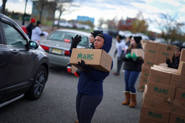 Volunteers load boxes of food into cars during an event held by the Community FoodBank of New Jersey in partnership with Bergen County to deliver emergency food relief to Federal workers and SNAP recipients amid the U.S. government shutdown in Leonia, New Jersey, on November 6, 2025. (Photo by Mike Segar/Reuters)