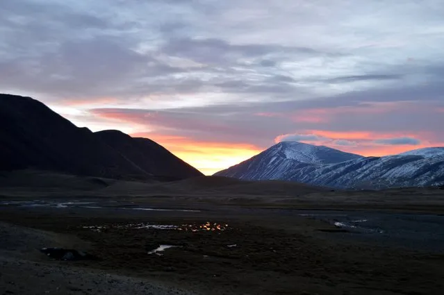 The sun rises in the valley near the Chinese/Russian border. (Photo by Brad Ruoho/The Star Tribune)
