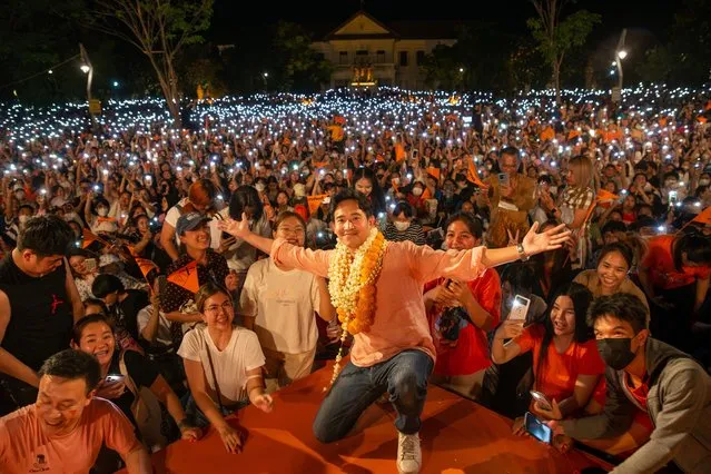 The leader of Move Forward party, Pita Limjaroenrat, (C), poses for photos with his supporters during a general election campaign event at Three Kings Monument in Chiang Mai, Thailand on April 30, 2023. (Photo by Pongmanat Tasiri/SOPA Images/Rex Features/Shutterstock)
