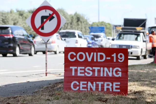 Signs direct drivers waiting for a COVID-19 testing at a pop-up testing centre at Marsden Point, New Zealand, on Monday, January 25, 2021. Health officials in New Zealand say genome tests indicate the country's most recent COVID-19 patient contracted the virus from another returning traveler just before leaving quarantine. (Photo by Tania Whyte/Northern Adivacate/NZME via AP Photo)