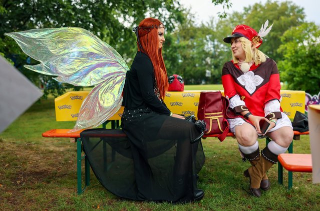 Costumed visitors attend the Elbenwald Festival at the Spreeauenpark in Cottbus, Germany, 02 August 2024. The festival is primarily a three-day gathering for fans of popular science fiction and fantasy series such as Harry Potter, Star Wars, Lord of the Rings, or Marvel Comics. About 15,000 visitors are expected to attend. (Photo by Hannibal Hanschke/EPA)