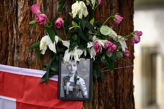 This photograph shows a picture of late Swiss teenage cyclist Muriel Furrer at a makeshift altar in Zurich, on September 29, 2024, on the sidelines of the men's Elite Road Race cycling event during the UCI 2024 Road World Championships. Swiss teenage cyclist Muriel Furrer died on September 27, 2024 a day after suffering a serious head injury in a crash at the world championships. (Photo by Fabrice Coffrini/AFP Photo)