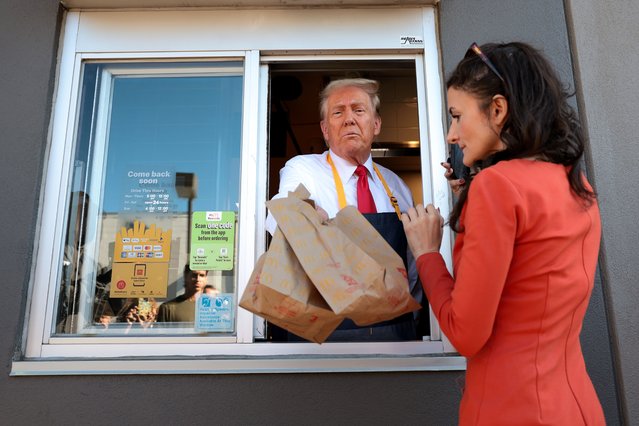 Republican presidential nominee, former U.S. President Donald Trump works the drive-through line as he visits a McDonald's restaurant on October 20, 2024 in Feasterville-Trevose, Pennsylvania. Trump is campaigning the entire day in the state of Pennsylvania. Trump and Democratic presidential nominee Vice President Kamala Harris continue to campaign in battleground swing states ahead of the November 5th election. (Photo by Win McNamee/Getty Images)