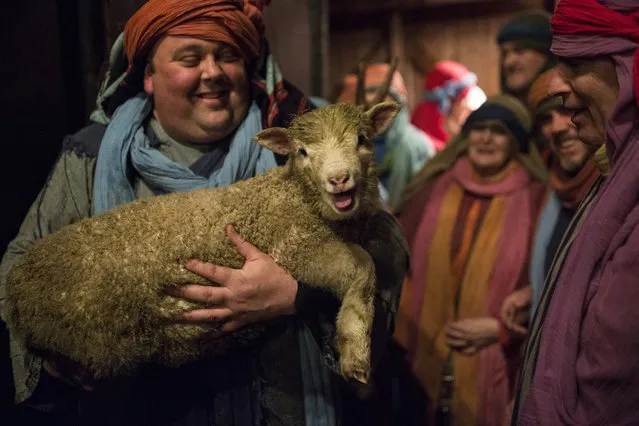 Actors take part in a full dress rehearsal of the Wintershall Nativity play at the Wintershall Estate on December 15, 2015 in Guildford, England. The Wintershall's theatrical production of the Nativity depicts a Christian Christmas and is complete with shepherds and sheep, donkeys and the three wise men on horseback. It will be performed from December 16-20, 2015 at the Wintershall Estate near Guildford in Surrey. (Photo by Dan Kitwood/Getty Images)