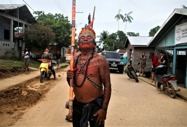 Kanamri Indigenous man Eduardo Kanamari marches to protest against the disappearance of Indigenous expert Bruno Pereira and freelance British journalist Dom Phillips, in Atalaia do Norte, Vale do Javari, Amazonas state, Brazil, Monday, June 13, 2022. Brazilian police are still searching for Pereira and Phillips, who went missing in a remote area of Brazil's Amazon a week ago. (Photo by Edmar Barros/AP Photo)