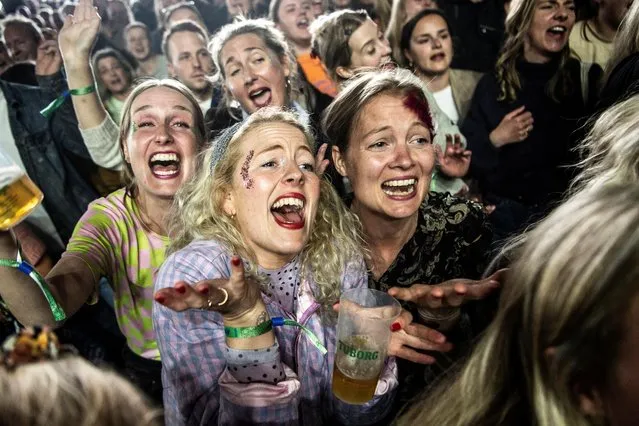 Fans react as Danish singer Thomas Helmig performs during a concert at the Northside Festival in Aarhus, Denmark on June 3, 2022. (Photo by Helle Arensbak/Ritzau Scanpix via Reuters)