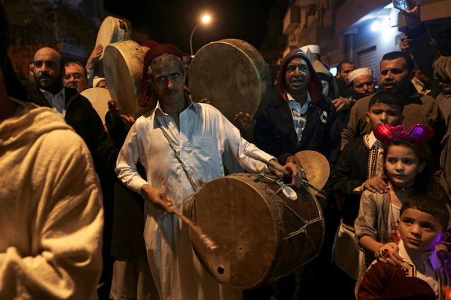 Libyan Sufi Muslims chant and beat drums during a procession celebrating the religious holiday of Mawlid al-Nabi, the birthday of Prophet Mohammad, in Benghazi, Libya December 10, 2016. (Photo by Esam Omran Al-Fetori/Reuters)