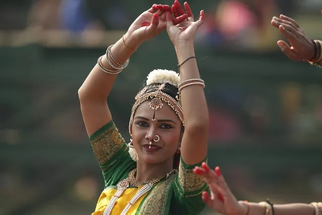 An Indian artist performs as she takes part in the full dress rehearsal for the Republic Day parade in New Delhi, India, January 23, 2016. (Photo by Adnan Abidi/Reuters)