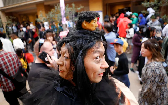 A participant in costume poses for the camera after a Halloween parade in Kawasaki, south of Tokyo, Japan on October 28, 2018. (Photo by Toru Hanai/Reuters)