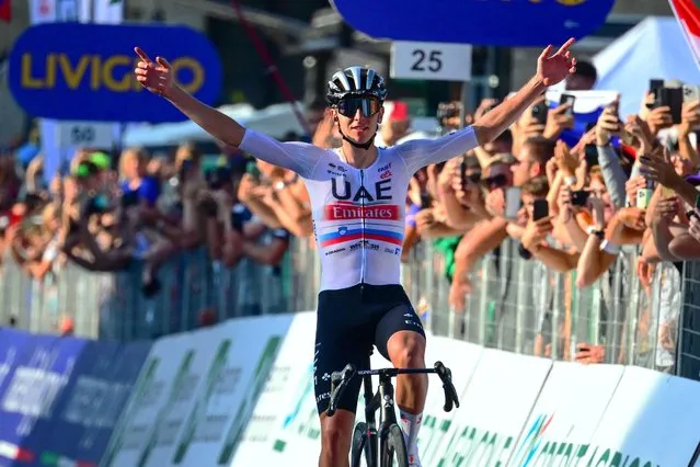 UAE Team Emirates team's Slovenian rider Tadej Pogacar celebrates as he crosses the finish line to win the 117th edition of the Giro di Lombardia (Tour of Lombardy), a 238km cycling race from Como to Bergamo on October 7, 2023. (Photo by Marco Bertorello/AFP Photo)