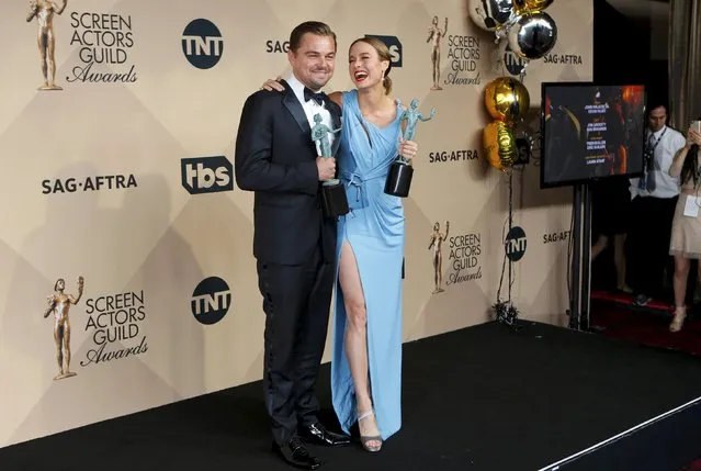 Actor Leonardo DiCaprio poses with his award for Outstanding Performance by a Male Actor in a Leading Role for his role in “The Revenant” and Brie Larson poses with her award for Outstanding Performance by a Female Actor in a Leading Role for her work in “Room” backstage at the 22nd Screen Actors Guild Awards in Los Angeles, California January 30, 2016. (Photo by Mike Blake/Reuters)