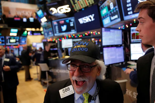 Trader Peter Tuchman works on the floor at the New York Stock Exchange (NYSE) in Manhattan, New York City, U.S., December 21, 2016. (Photo by Andrew Kelly/Reuters)
