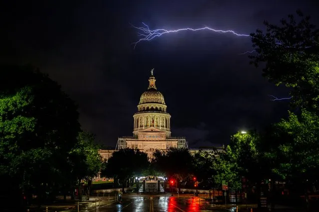 Lightning flashes behind the Texas State Capitol on April 27, 2023 in Austin, Texas. (Photo by Brandon Bell/Getty Images)