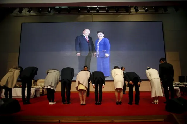 Couples rehearse in front of a portrait of the late evangelist Reverend Moon Sun-myung (L) and his wife Han Hak-ja after an opening ceremony for upcoming mass wedding ceremony of the Unification Church at Cheongshim Peace World Centre in Gapyeong, South Korea, February 19, 2016. (Photo by Kim Hong-Ji/Reuters)