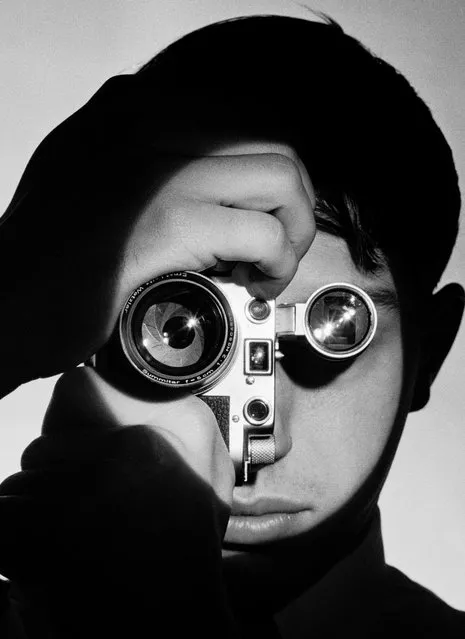 Young man (photographer Dennis Stock) holding camera in front of his face so that lense looks like his right eye & viewfinder his left on June 01, 1951. (This picture was basis for story that Feininger later developed for LIFE in 1955). (Photo by Andreas Feininger/The LIFE Picture Collection/Getty Images)