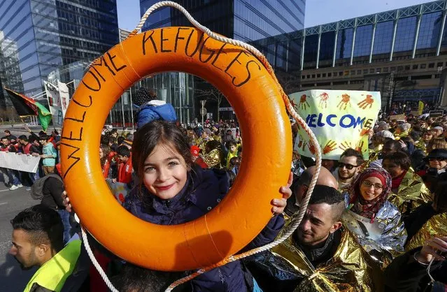 People take part in a rally asking for a change in the refugee policy in Europe as part of an international initiative in favour of better living conditions of migrants, in Brussels, Belgium February 27, 2016. (Photo by Yves Herman/Reuters)