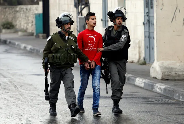 Israeli border policemen detain a Palestinian during clashes following a protest in the West Bank city of Bethlehem January 26, 2017. (Photo by Mussa Qawasma/Reuters)