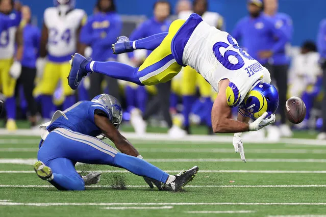 Tyler Higbee #89 of the Los Angeles Rams is hit by Kerby Joseph #31 of the Detroit Lions during the second half in the NFC Wild Card Playoffs at Ford Field on January 14, 2024 in Detroit, Michigan. (Photo by Gregory Shamus/Getty Images)
