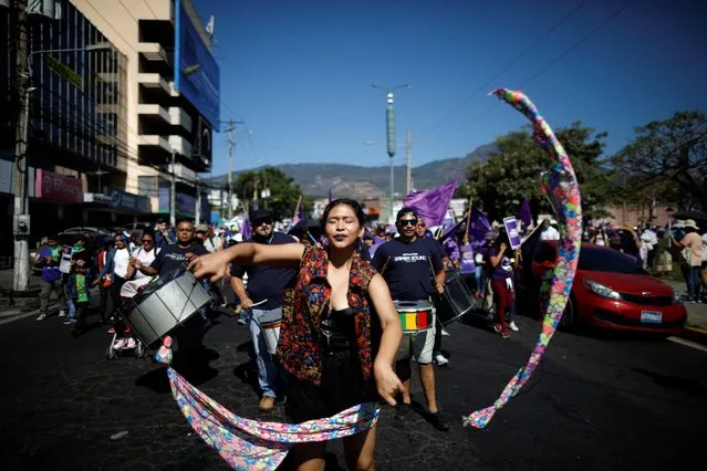 Activists perform during a nationwide feminist strike on International Women's Day in San Salvador, El Salvador on March 8, 2019. (Photo by Jose Cabezas/Reuters)