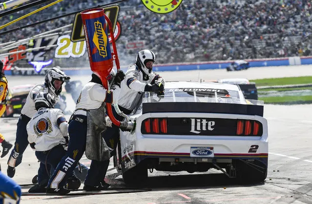 Driver Brad Keselowski's pit crew service his car during a NASCAR Cup auto race at Texas Motor Speedway, Sunday, March 31, 2019, in Fort Worth, Texas. (Photo by Randy Holt/AP Photo)