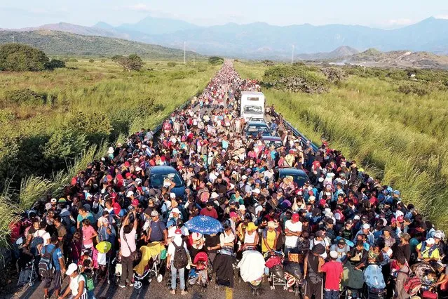 Migrants take part in a caravan heading to Mexico City, in Arriaga, Mexico November 6, 2021. Picture taken with a drone. (Photo by Raquel Cunha/Reuters)
