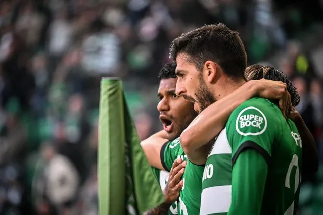 Sporting's Portuguese forward #20 Paulinho (R) celebrates scoring the opening goal during the UEFA Europa League last 16 first leg football match between Sporting CP and Atalanta at the Jose Alvalade stadium in Lisbon on March 6, 2024. (Photo by Patricia De Melo Moreira/AFP Photo)