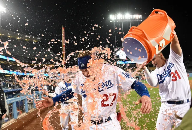 Los Angeles Dodgers center fielder Alex Verdugo (27) is doused with liquid by left fielder Joc Pederson (31) after hitting a walk-off sacrifice fly against the New York Mets at Dodger Stadium on May 29, 2019 in Los Angeles, CA, USA. The Dodgers won Mets 9-8. (Photo by Kirby Lee/USA TODAY Sports)